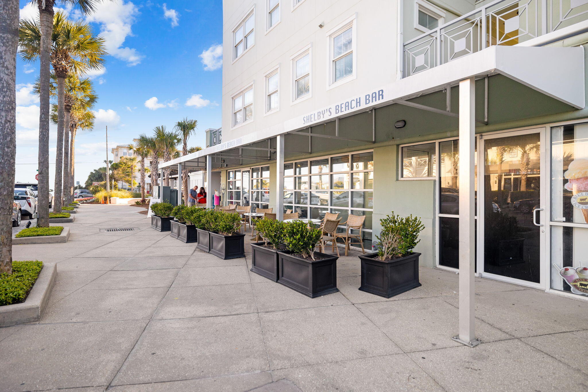 45 Town Center Loop, Unit 416 Santa Rosa Beach, FL 32459 - Photo 28 of 32 a building with potted plants in front of it