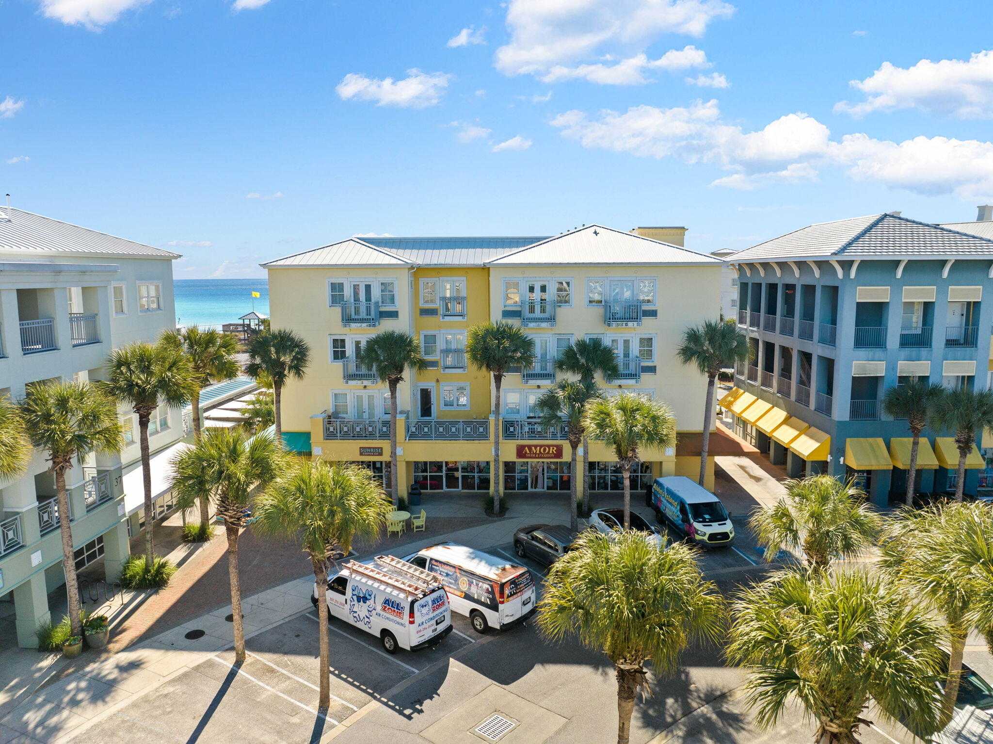 45 Town Center Loop, Unit 416 Santa Rosa Beach, FL 32459 - Photo 3 of 32 a view of a patio with couches table and chairs and potted plants