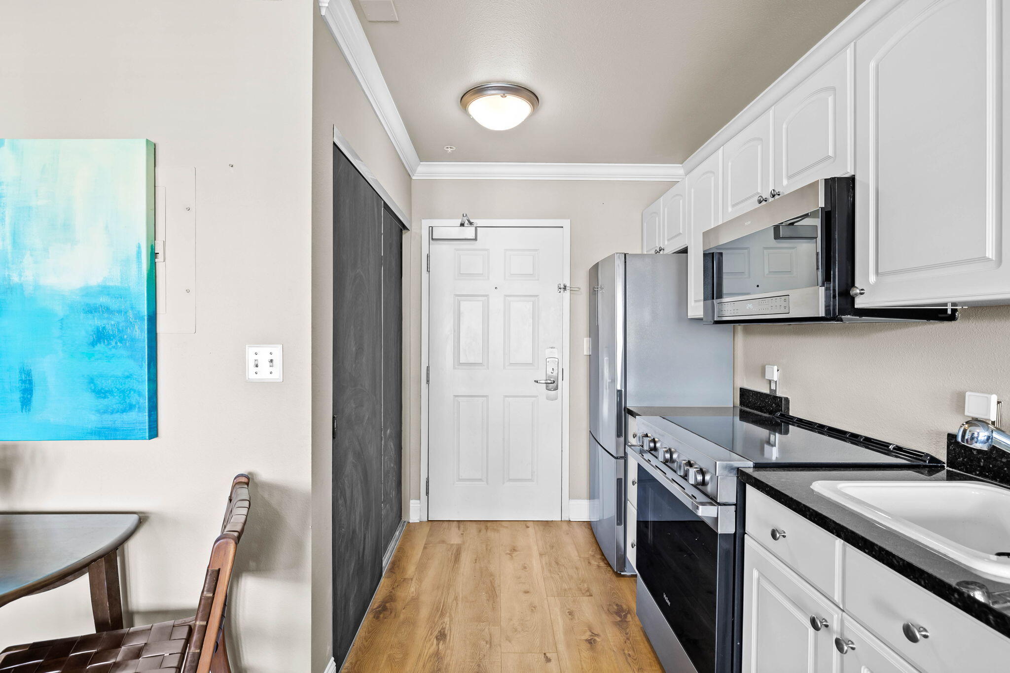 45 Town Center Loop, Unit 416 Santa Rosa Beach, FL 32459 - Photo 7 of 32 a kitchen with stainless steel appliances granite countertop a sink stove and refrigerator