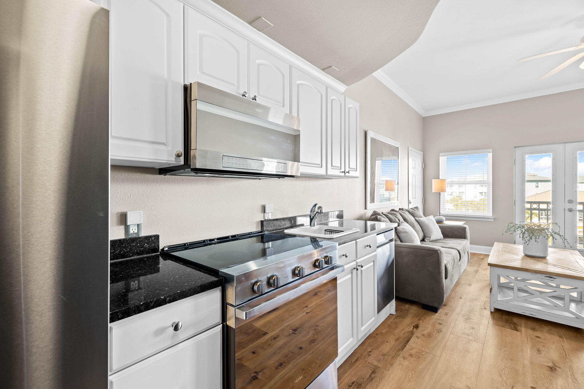 45 Town Center Loop, Unit 416 Santa Rosa Beach, FL 32459 - Photo 10 of 32 a kitchen with a sink a stove and cabinets