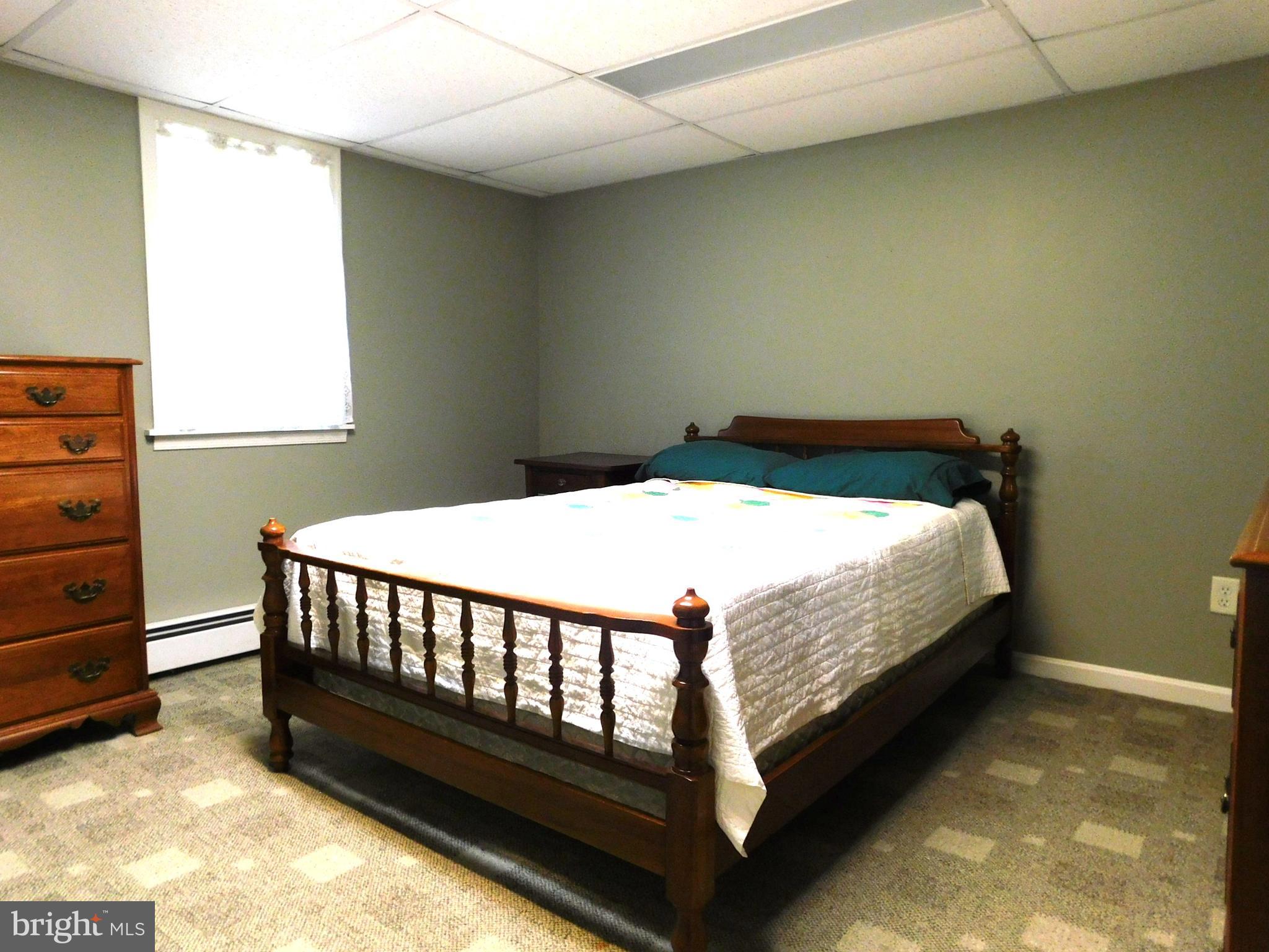 15253 Ressler Lane Blue Ridge Summit, PA 17214 - Photo 11 of 21 a bed sitting in a bedroom next to a window