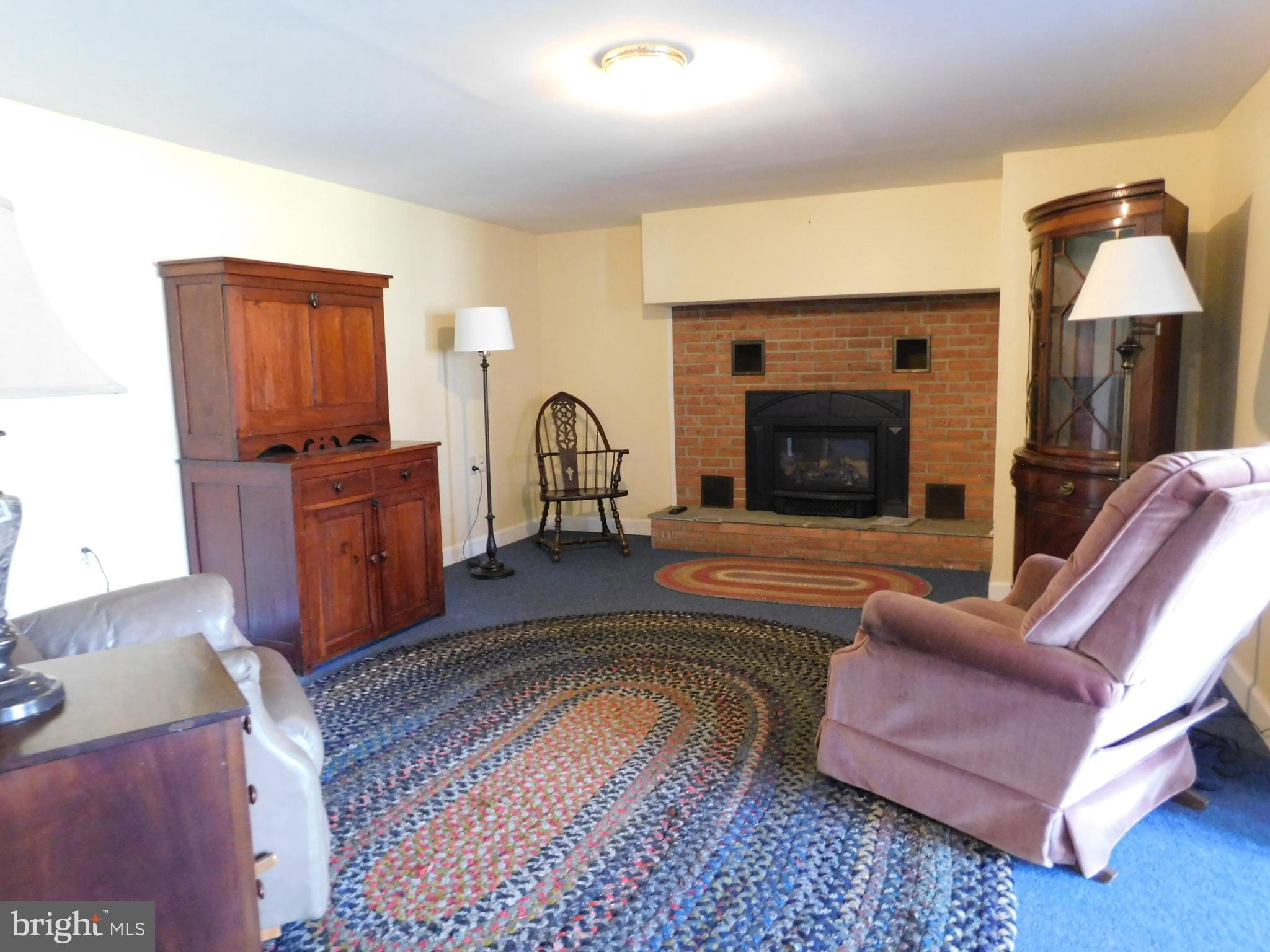 15253 Ressler Lane Blue Ridge Summit, PA 17214 - Photo 13 of 21 a living room with furniture and a fireplace