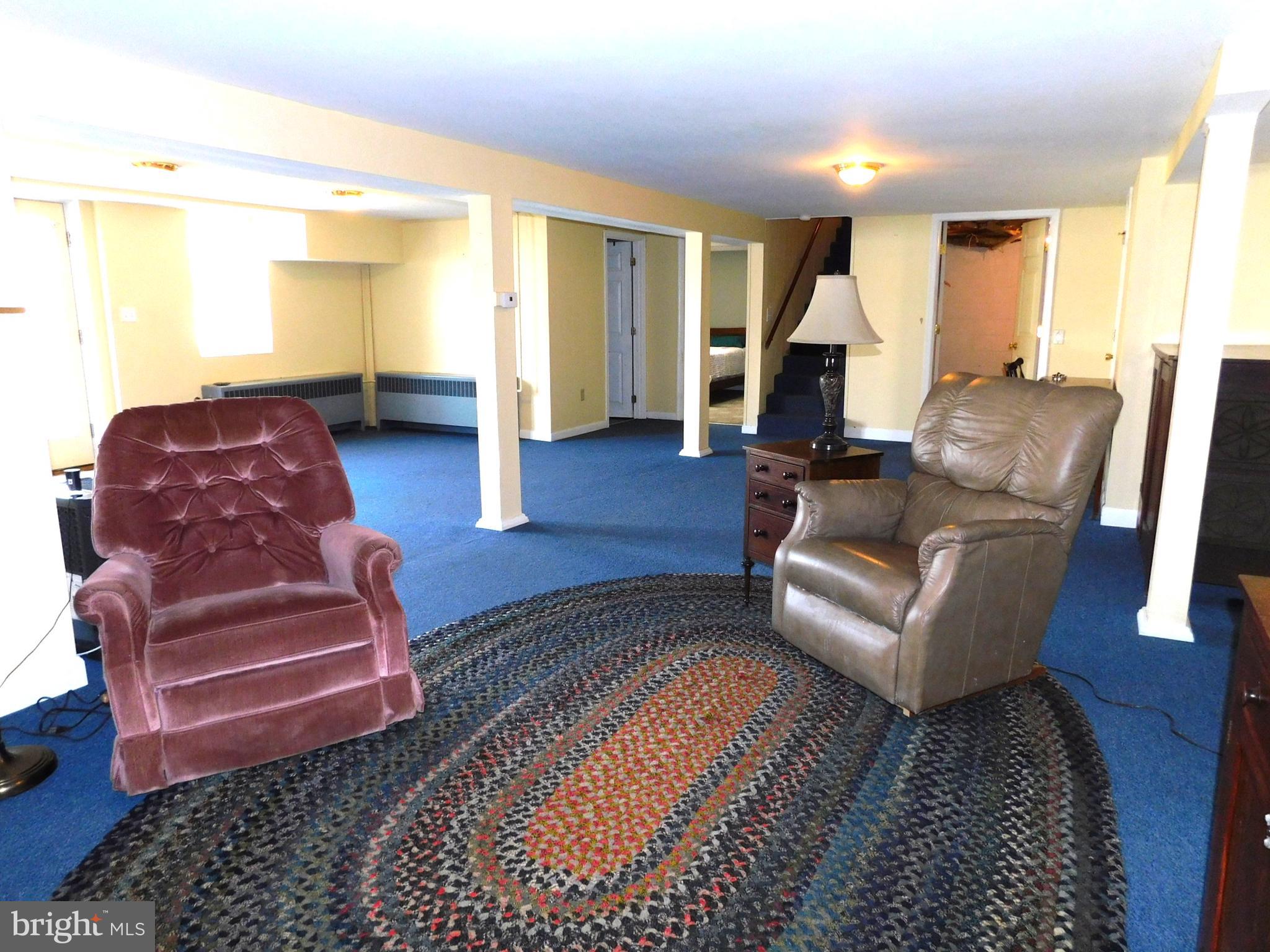 15253 Ressler Lane Blue Ridge Summit, PA 17214 - Photo 14 of 21 a living room with furniture and a fireplace
