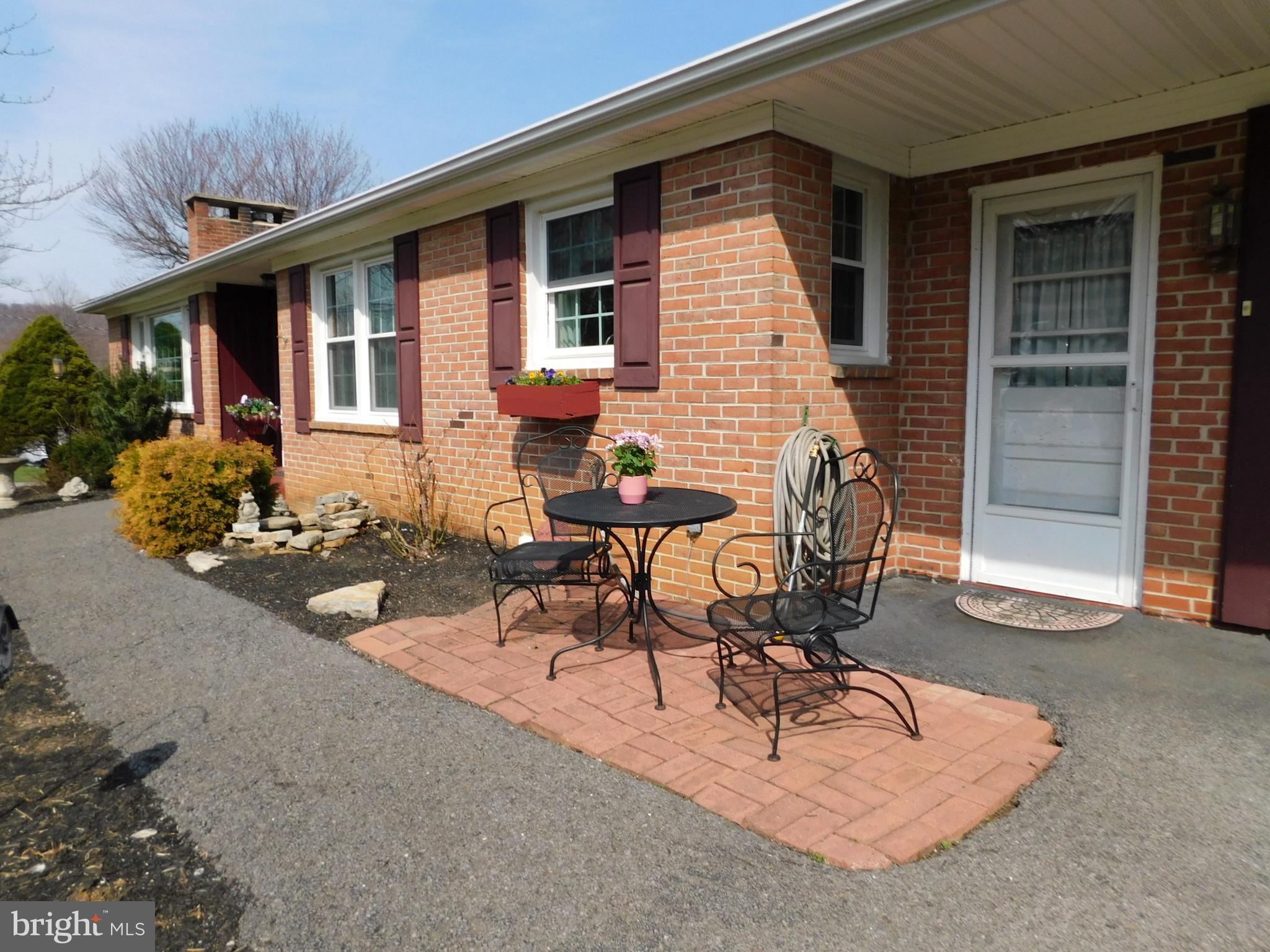 15253 Ressler Lane Blue Ridge Summit, PA 17214 - Photo 21 of 21 a view of a patio with table and chairs with wooden fence