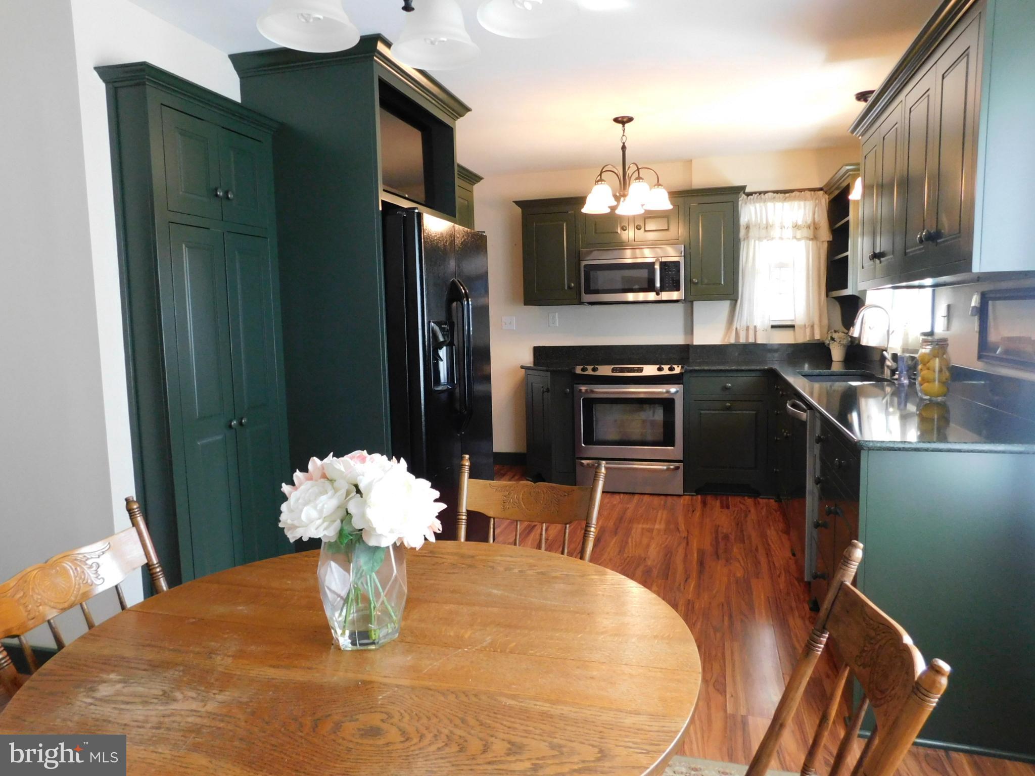 15253 Ressler Lane Blue Ridge Summit, PA 17214 - Photo 3 of 21 a kitchen with stainless steel appliances granite countertop a sink refrigerator and microwave
