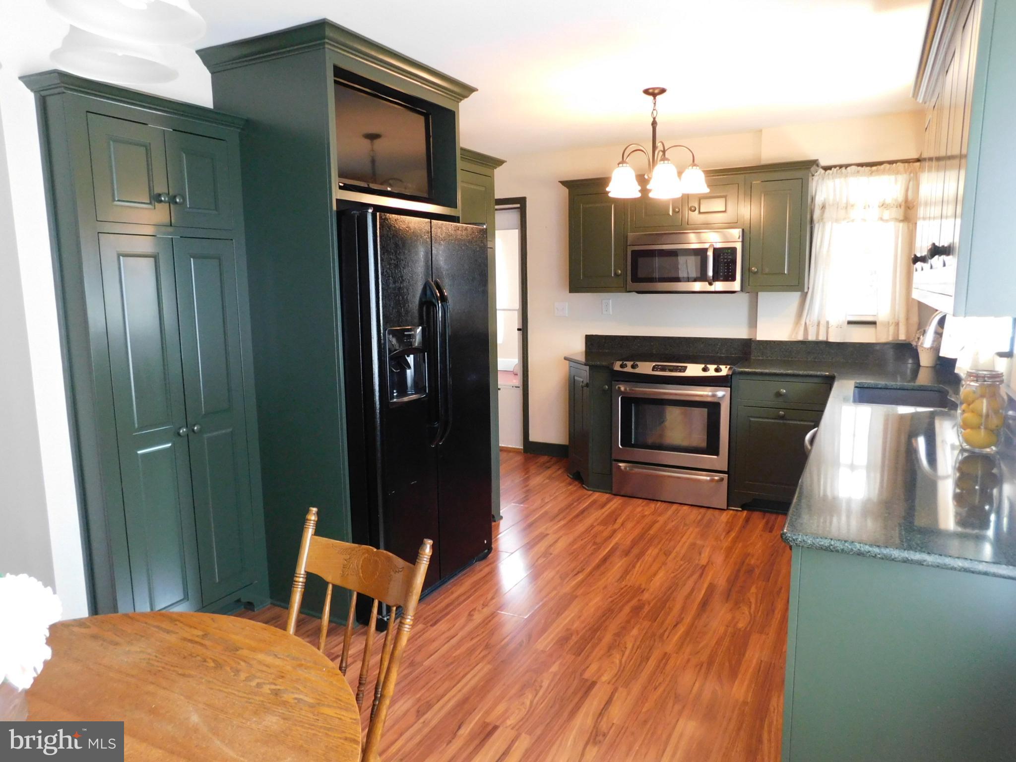 15253 Ressler Lane Blue Ridge Summit, PA 17214 - Photo 4 of 21 a kitchen with stainless steel appliances granite countertop a refrigerator a stove top oven a sink and dishwasher