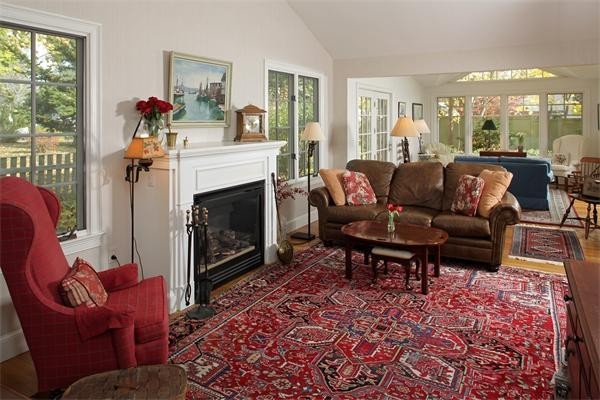 38 Standish Road Duxbury, MA 02332 - Photo 11 of 21 a living room with furniture rug and a fireplace