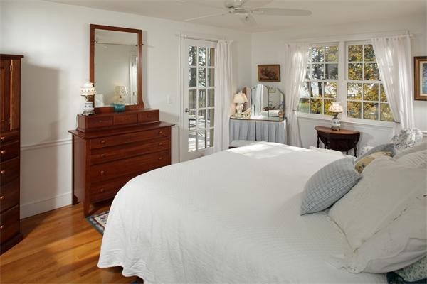 38 Standish Road Duxbury, MA 02332 - Photo 13 of 21 a bedroom with a bed and wooden floor