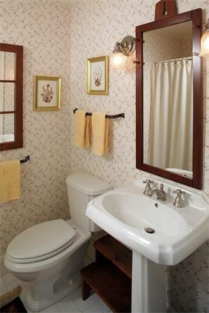 38 Standish Road Duxbury, MA 02332 - Photo 8 of 21 a bathroom with a sink a toilet and mirror