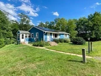 a house view with a garden space
