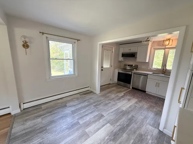 a view with a kitchen counter space and a window