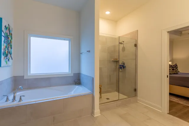 a bathroom with a shower and a bathtub