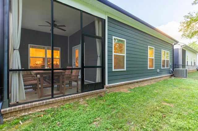 a view of front door and yard