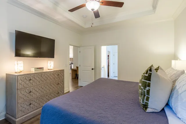 a bedroom with a bed and a flat screen tv