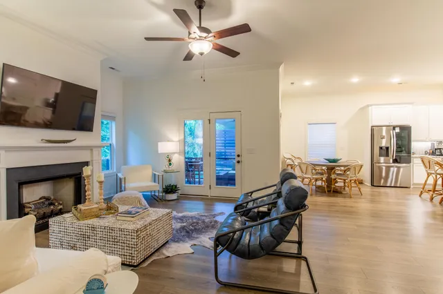 a living room with furniture fireplace and flat screen tv