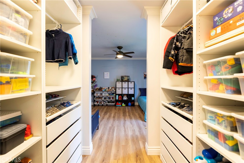 20702 El Toro Road, Unit 178 Lake Forest, CA 92630 - Photo 14 of 30 a view of walk in closet with clothes and shoes