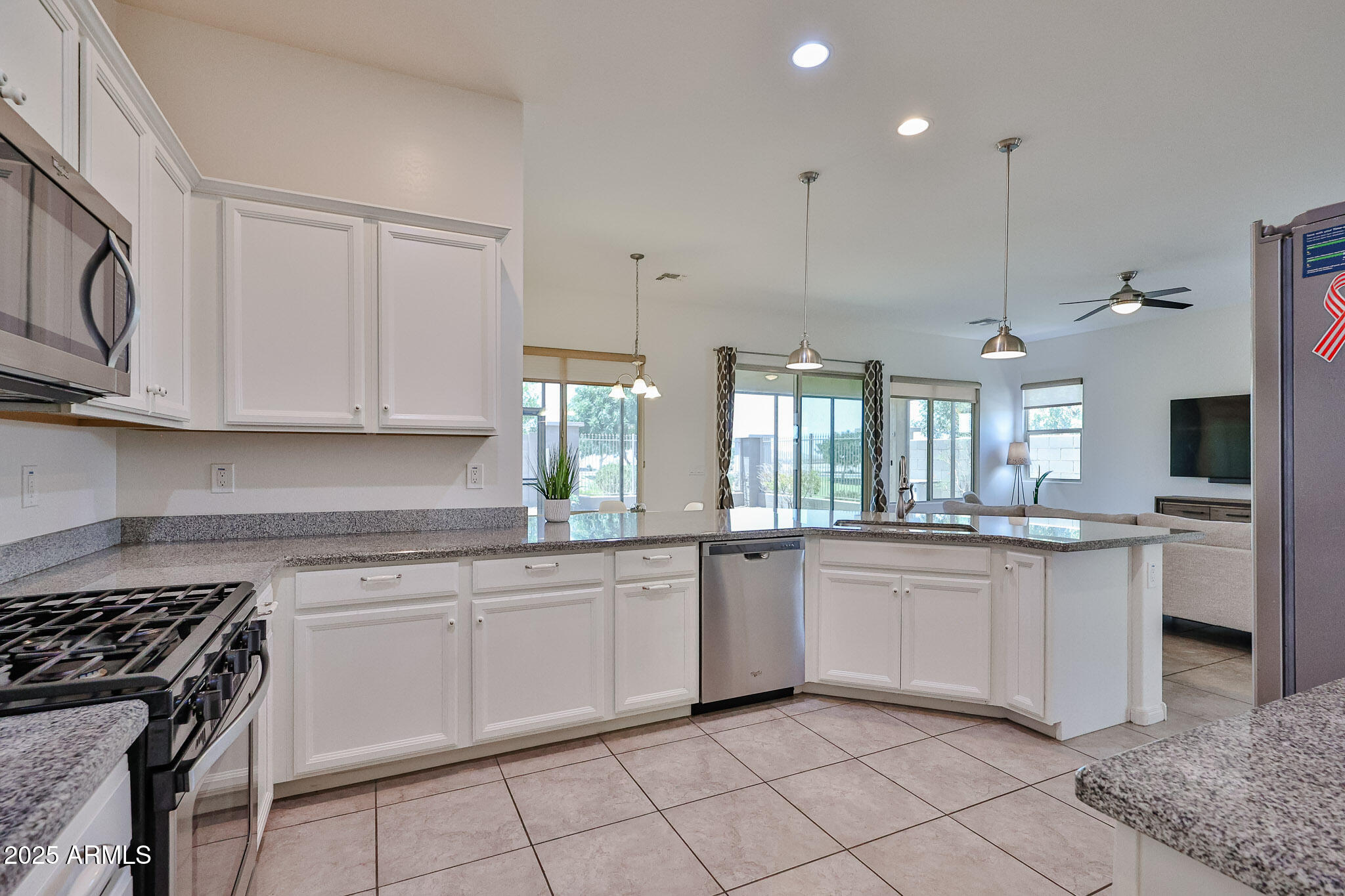 17082 South 182nd Avenue Goodyear, AZ 85338 - Photo 14 of 71 a kitchen with white cabinets and appliances