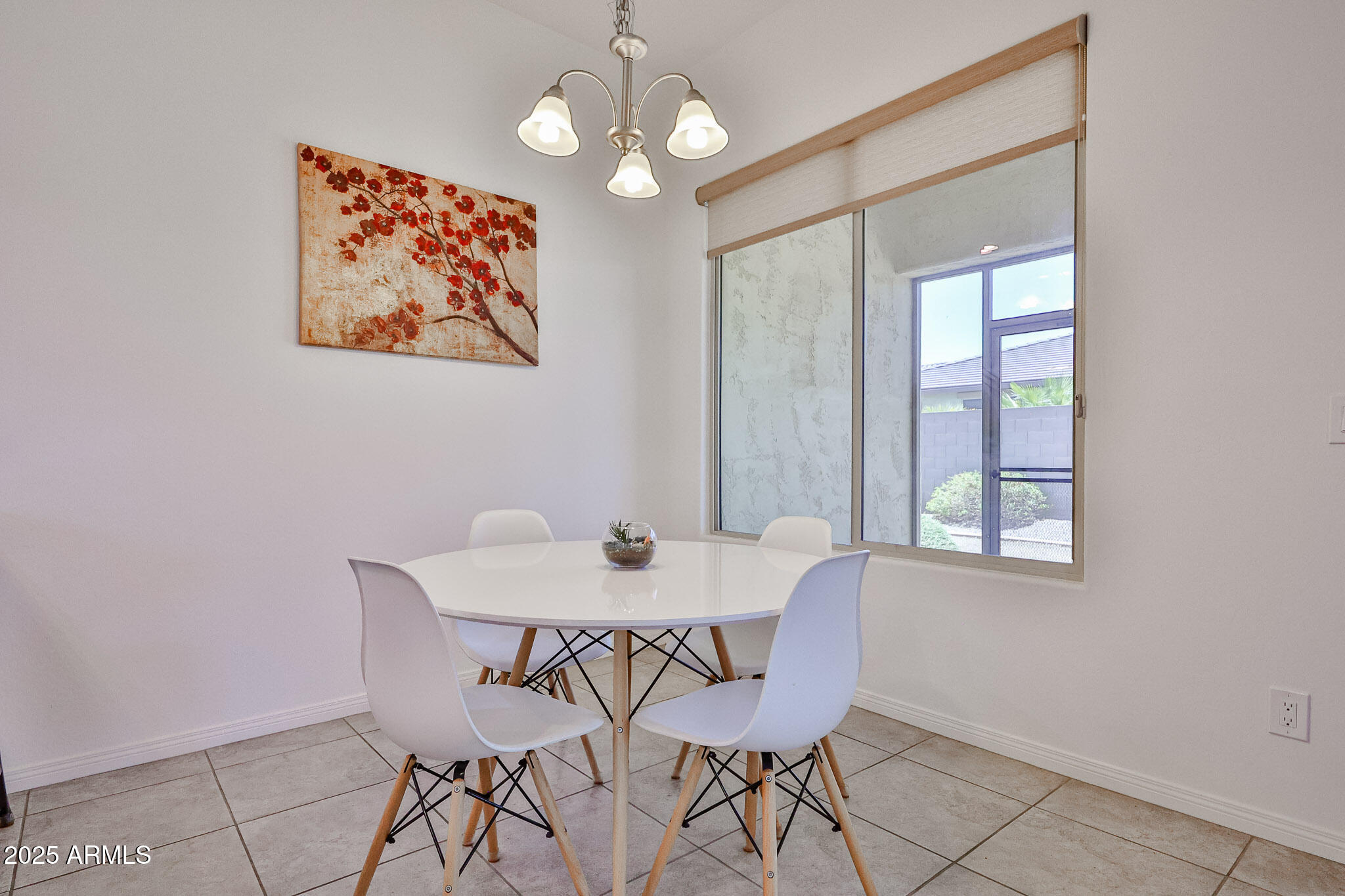 17082 South 182nd Avenue Goodyear, AZ 85338 - Photo 18 of 71 a view of a dining room with furniture and chandelier