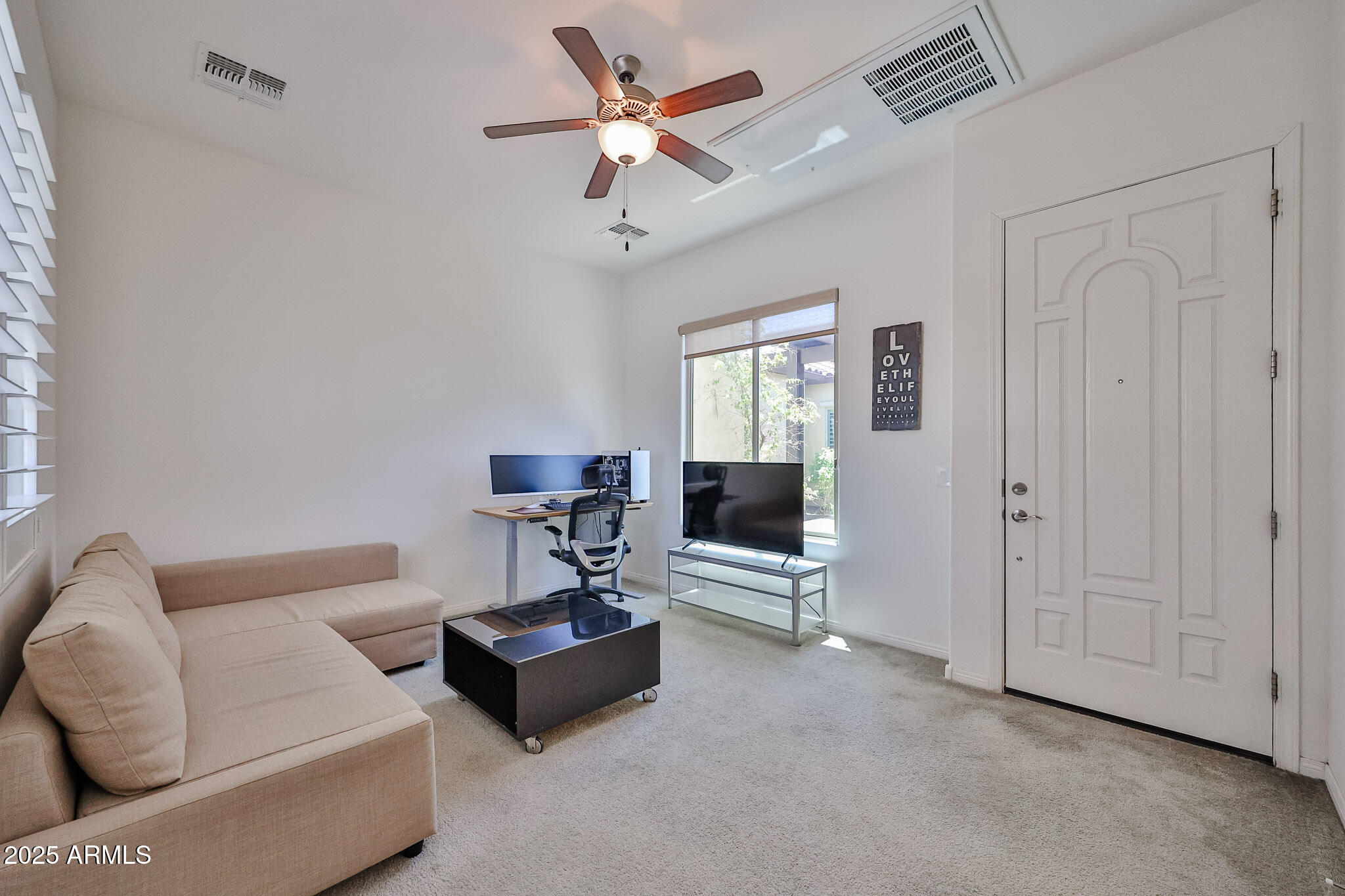 17082 South 182nd Avenue Goodyear, AZ 85338 - Photo 8 of 71 a living room with furniture and a ceiling fan