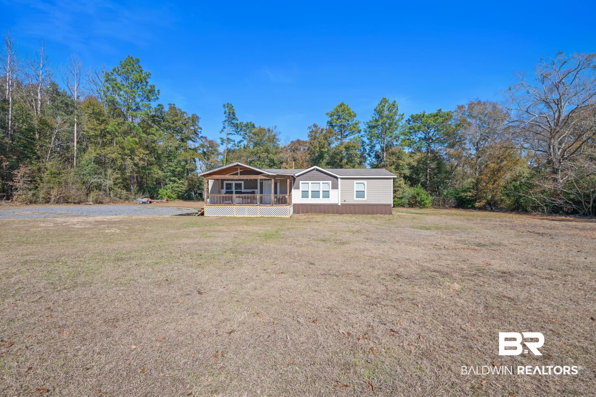 15080 Starlight Avenue Wilmer, AL 36587 - Photo 1 of 29 View of front of property featuring a porch and a front yard