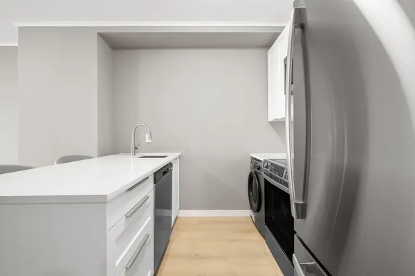 a view of a room with a table and chairs