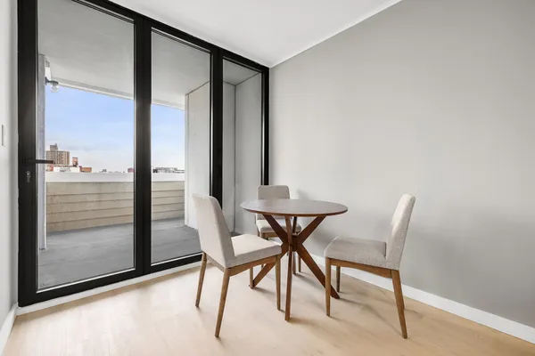 a bedroom with a large bed and a large window