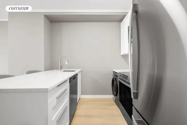 a bedroom with a large bed and a large window