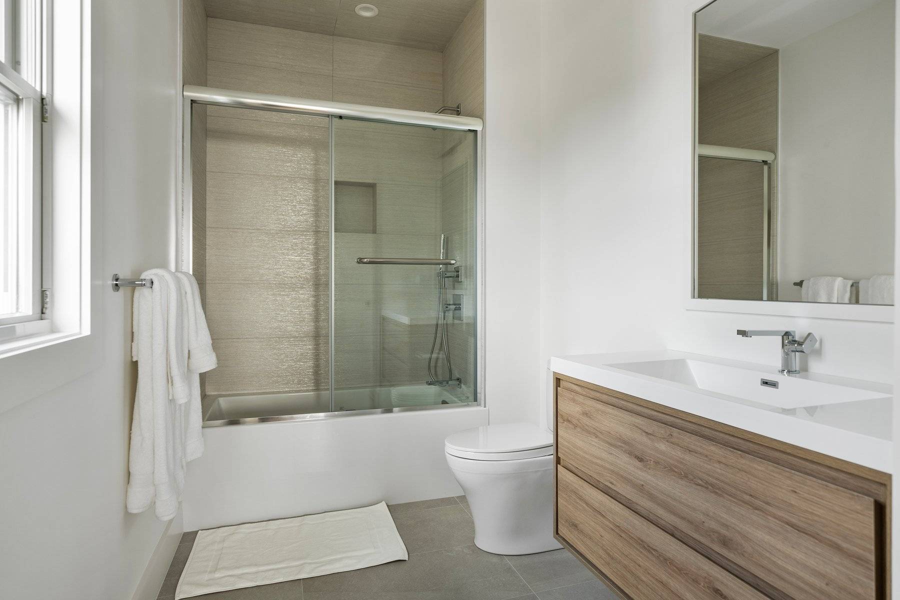 686 Dune Road Westhampton Beach, NY 11978 - Photo 15 of 37 a bathroom with a sink and a mirror