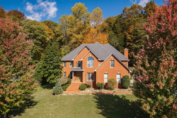 a front view of a house with a yard