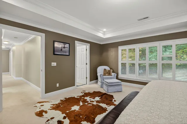 a living room with a couch and a large window
