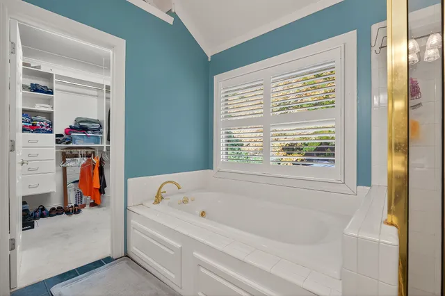 a white bath tub sitting next to a window