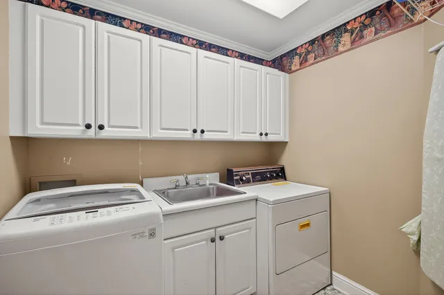 a bedroom with furniture and a chandelier