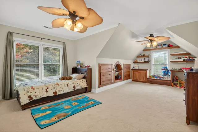 a view of a livingroom with furniture and a garage