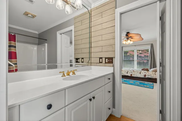 a spacious bedroom with a bed and a large window