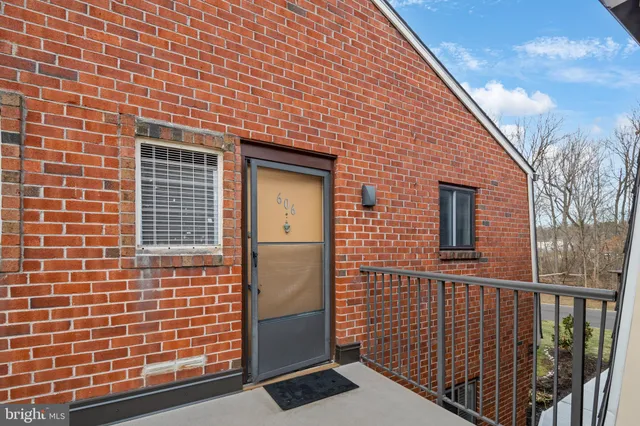 a view of a brick house with a window