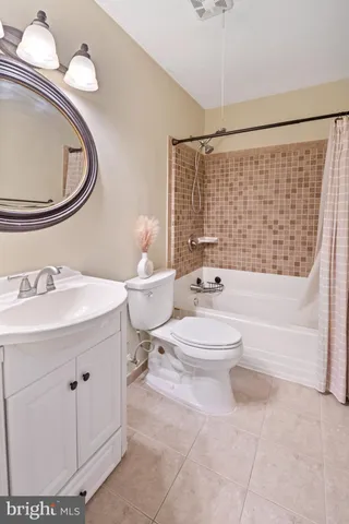 a bathroom with a toilet a sink and a bathtub