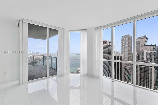 a view of a living room and furniture in a room