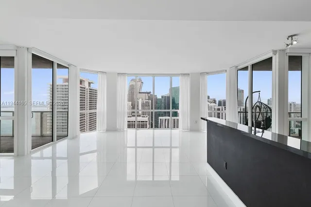 a view of a hallway with a living room