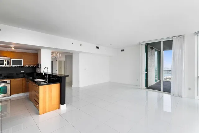 a room with furniture and a flat screen tv