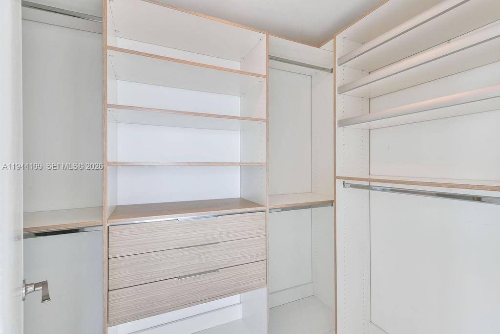 253 Northeast 2nd Street, Unit 4608 Miami, FL 33132 - Photo 29 of 37 a view of walk in closet with empty racks