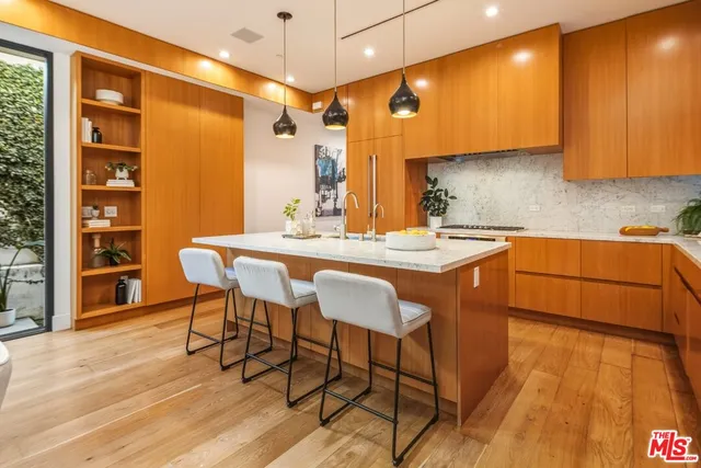a kitchen with a granite countertop sink and a granite counter top