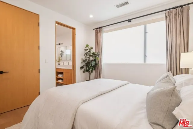 a en suite bathroom with a sink and a mirror