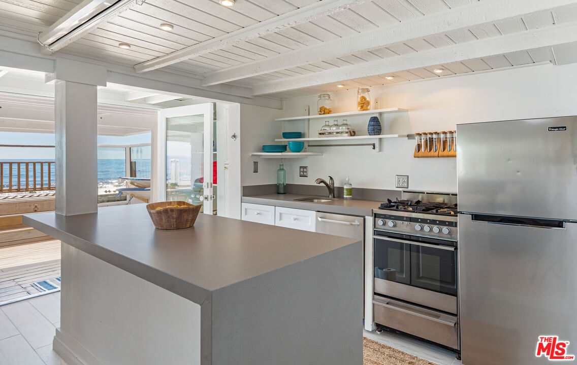 20828 Pacific Coast Highway Malibu, CA 90265 - Photo 18 of 23 a kitchen with stove cabinets and refrigerator