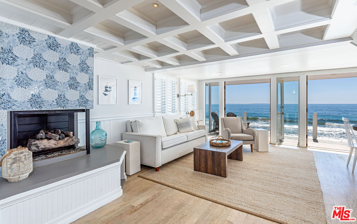 20828 Pacific Coast Highway Malibu, CA 90265 - Photo 3 of 23 a living room with furniture and a fireplace