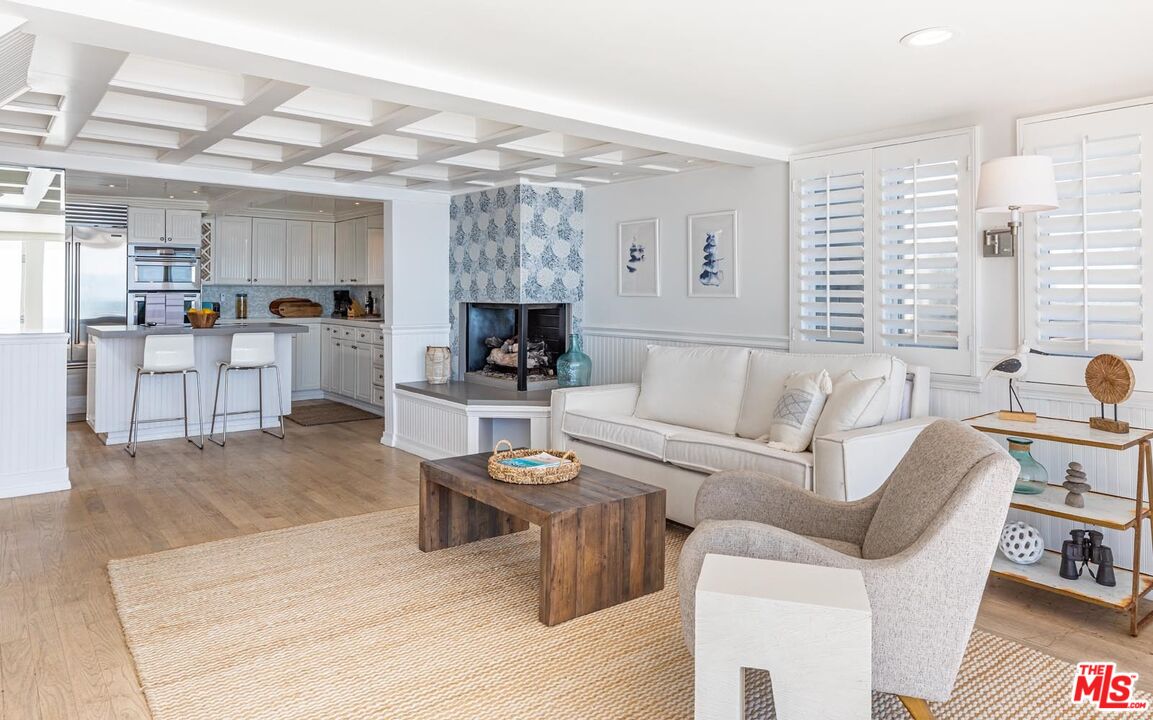 20828 Pacific Coast Highway Malibu, CA 90265 - Photo 5 of 23 a living room with furniture and a kitchen