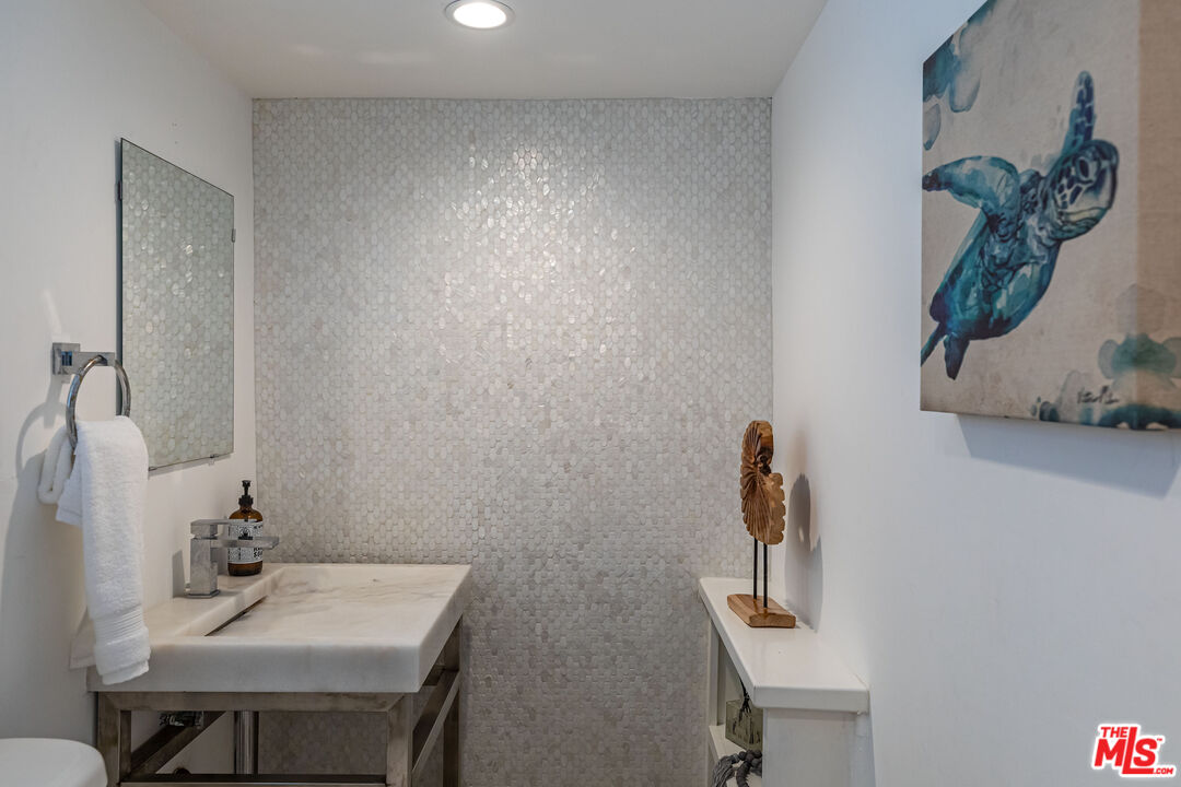 20828 Pacific Coast Highway Malibu, CA 90265 - Photo 8 of 23 a bathroom with a sink vanity and toilet