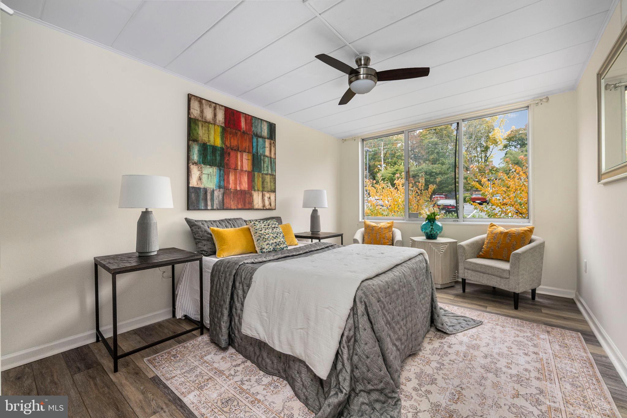 2302 Riddle Avenue, Unit 103 Wilmington, DE 19806 - Photo 10 of 25 Serene bedroom with vibrant autumn views.