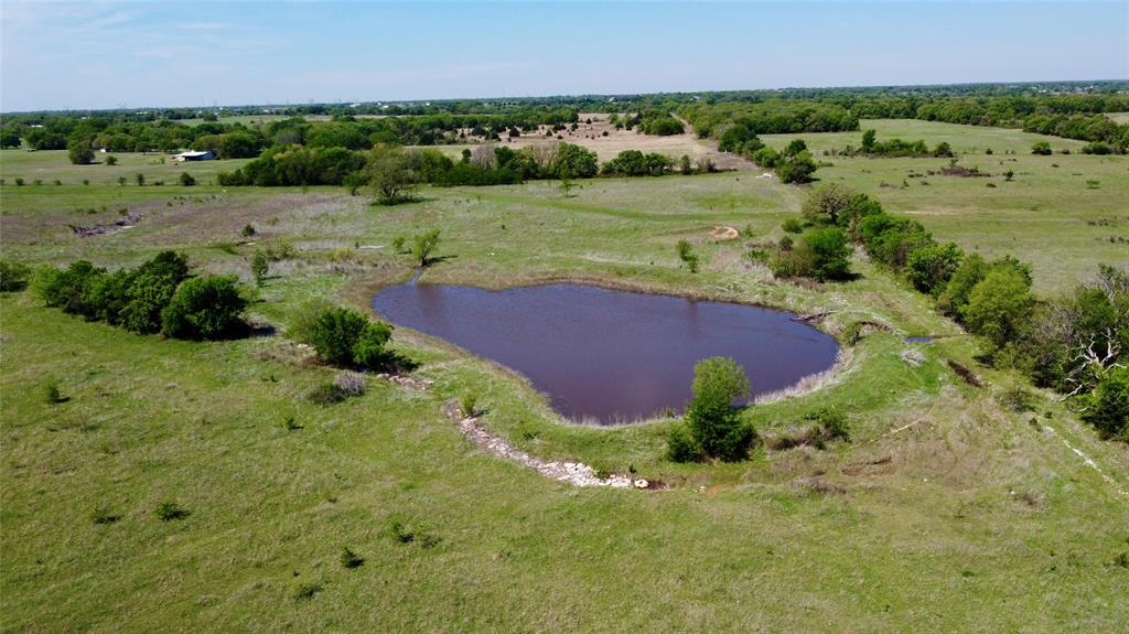 1 County Road 1475 Chico, TX 76431 - Photo 2 of 13 a view of a lush green outdoor space with a lake view and mountain view