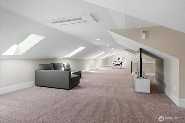 a view of living room with furniture and a ceiling fan