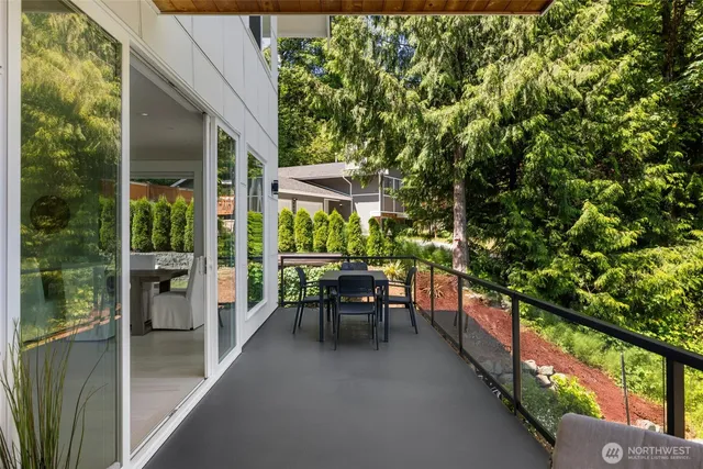 a view of a two chair in the balcony with wooden floor